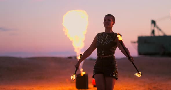 Fire Dancers Against Sunset