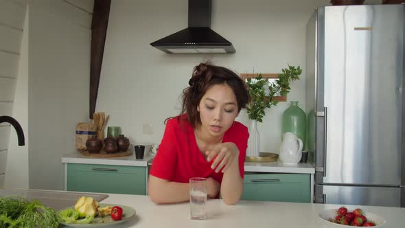 Young Beautiful Woman Applying Painkiller to Relieve Headache Indoors