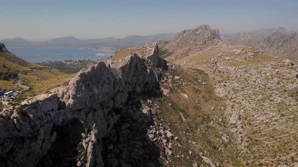 AERIAL: Mountains at Cape Formentor with view to Alcudia bay on Mallorca