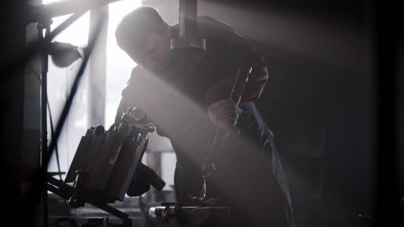 Blacksmith Workshop  a Man Shaping Heated Metal on an Anvil