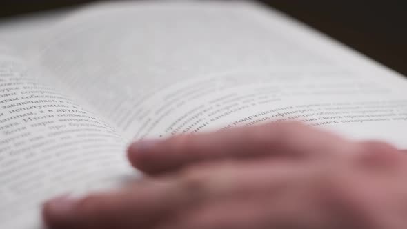 Turning Pages of a Book CloseUp Slow Motion