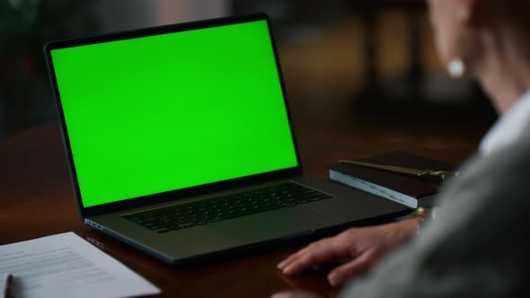Green Screen Laptop with Unknown Senior Woman Having Video Call at Home