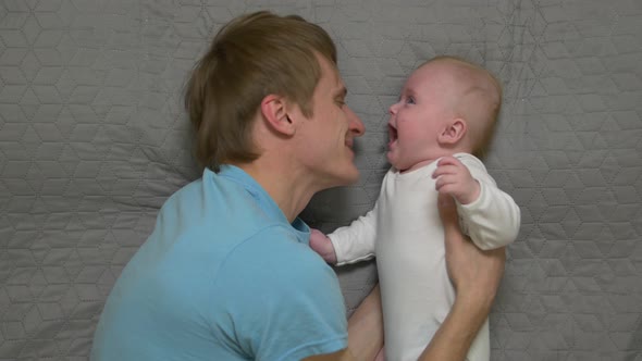 Father Hugging A Baby