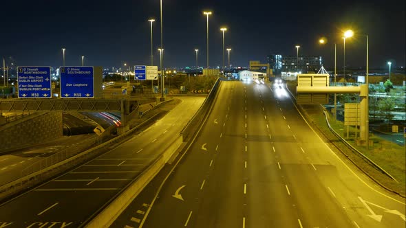 Vehicles Travelling At The N7 Motorway Town Exit In Dublin, Ireland At Night - timelapse