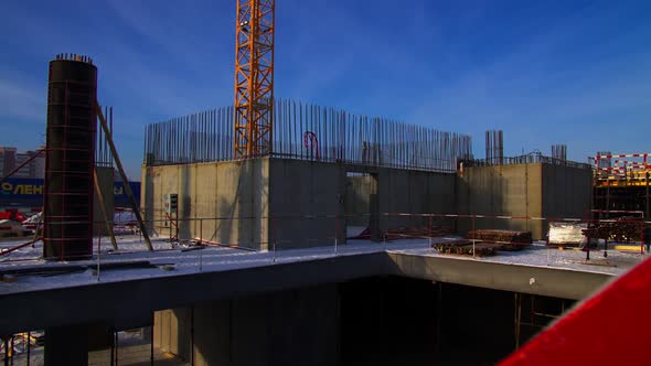Building Hallway with Metal Supports and Worker on Ladder alt