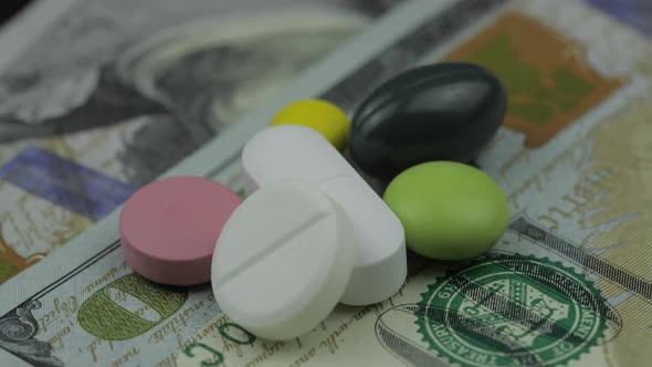 Medical Pills and Tablets on Dollar Banknote. Pharmaceutical Business Concept