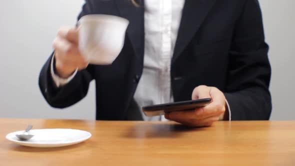 Businessman Working With Tablet And Drinking Coffee