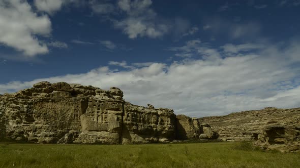 Time lapse of clouds moving over cliffs