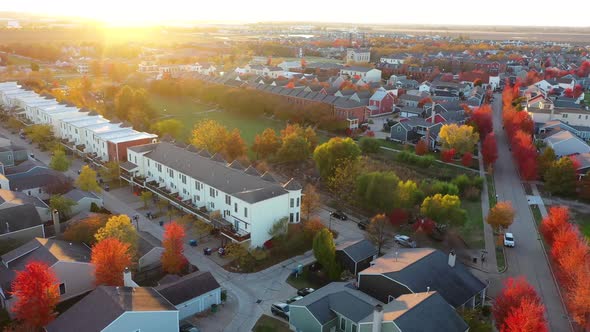 Colorful Fall Trees In Neighborhood Suburbs Sunset Drone Footage