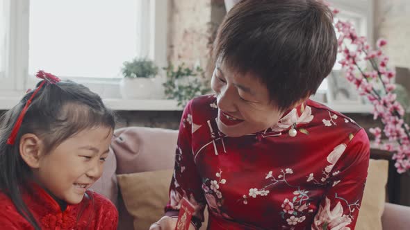 Chinese Mother and Daughter Celebrating Lunar New Year