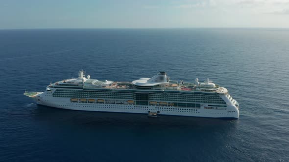 Aerial View. Cruise Ship with Full Passengers in the Sea.