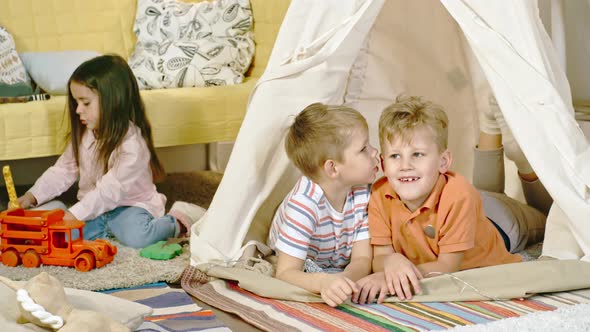 Little Boys Gossiping in Teepee alt