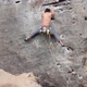 Muscular Man Climbing Up On Rocky Wall - VideoHive Item for Sale