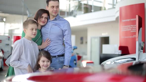 The family buys a car, happy family in car