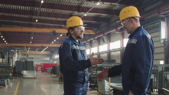 Factory Supervisors Shaking Hands After Successful Cooperation