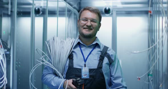 Adult Bearded Engineer in Server Room