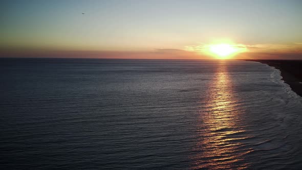 Drone Aerial View Dolly Side Panning Over Paradise Beach Sunrise