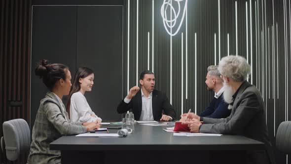 Business Team Happy Cause of Results of Work By Shaking Hands and Clapping