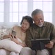 Asian senior couple in living room at home. - VideoHive Item for Sale