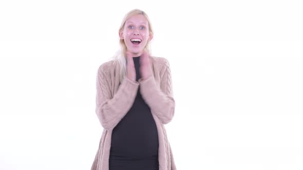 Happy Young Blonde Pregnant Woman Clapping Hands