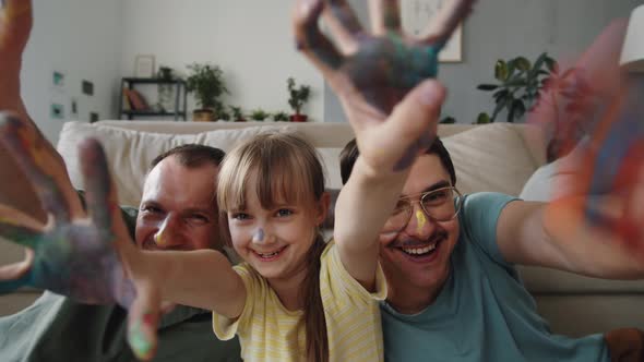 Family With Paint On Hands