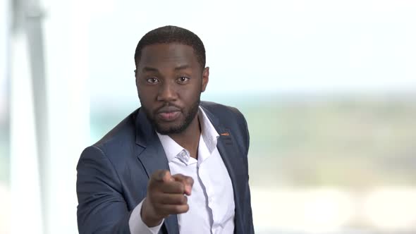 Black Annoyed Businessman Pointing with Finger