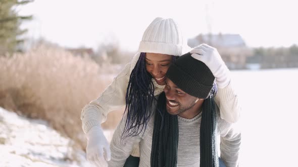 Stylish Couple Walking and Having Fun in the Countryside in Winter