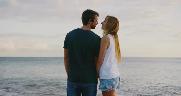 Romantic couple kissing on the beach