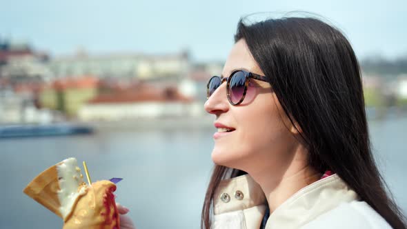 Closeup Adorable Smiling Woman in Sunglasses Eating Ice Cream Walking on Embankment Enjoying Break