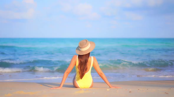 Asian woman enjoy around beautiful beach sea ocean