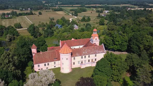 Edole Castle Manor and Old Village With Lake in Latvia, Aerial Shot.