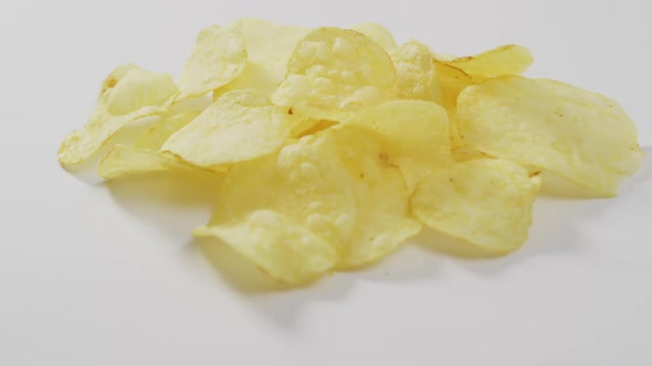 Close up of potato chips with copy space on white surface