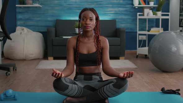 Flexible Flexible Athlete Woman Relaxing in Lotus Position on Floor