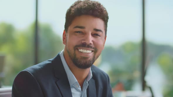 Smiling mid adult man looking at camera