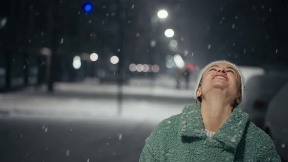 Cinematic Shot of Carefree Happy Smiling Young Woman Wearing Warm Hat is Excited and Amazed with