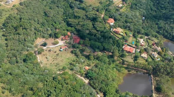 Aerial View of Valley with Farm Field, Forest and Villa in Tropical Country