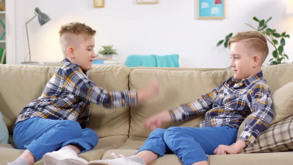 10-Year-Old Twin Boys Fooling Around at Home