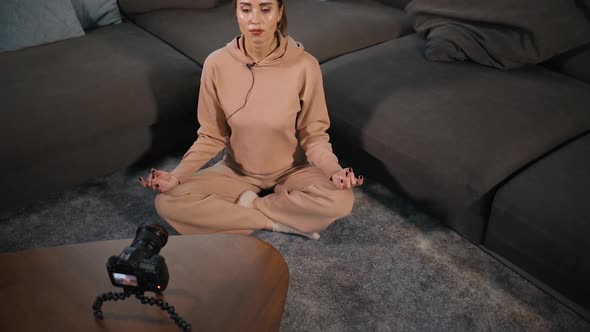 High Angle Young Female Blogger Recording Video of Meditation at Home