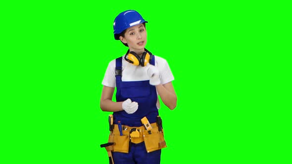 Girl Engineer Conducts a Program on Building Materials. Green Screen