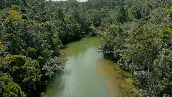 AERIAL: River in the middle of Rainforest in Madagascar