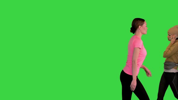 Many Different People Walking and Running From Side to Side on a Green Screen Chroma Key