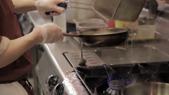 on Electric Stove Pan with Pasta Cooker Prepares in Restaurant