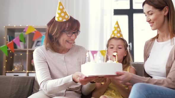 Mother, Daughter, Grandmother with Birthday Cake