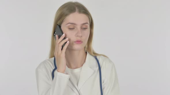 Female Doctor Talking on Phone on White Background