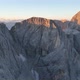 Dolomites mountains peaks with a hiking path on a summer sunrise - VideoHive Item for Sale