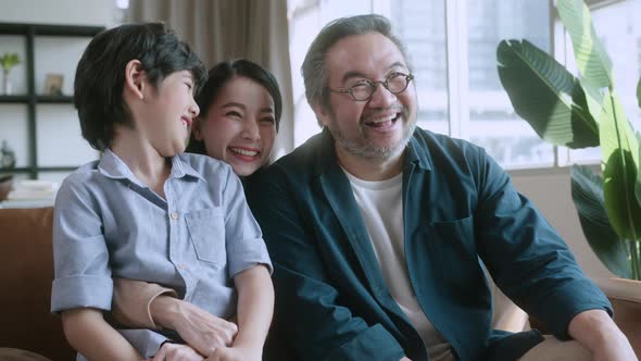 Asian family sit relax positive conversation with son, happiness smile boy