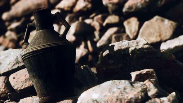 Old Metal Jug at Rocks