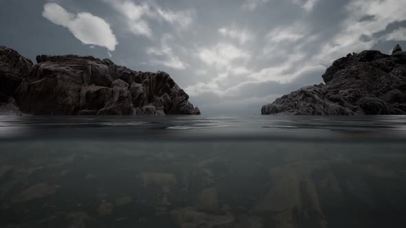 Half Underwater in Northern Sea with Rocks