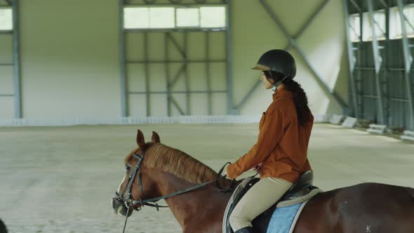 Woman Having Horseback Riding Lesson