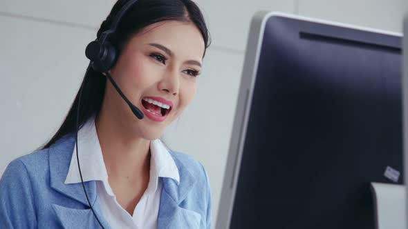 Customer Support Agent or Call Center with Headset Talking to Customer on Phone